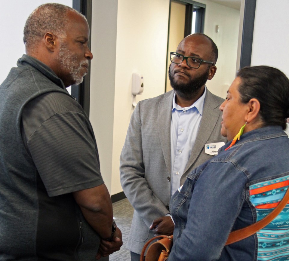 Program Administrator Greg Johnson speaking with a community leader